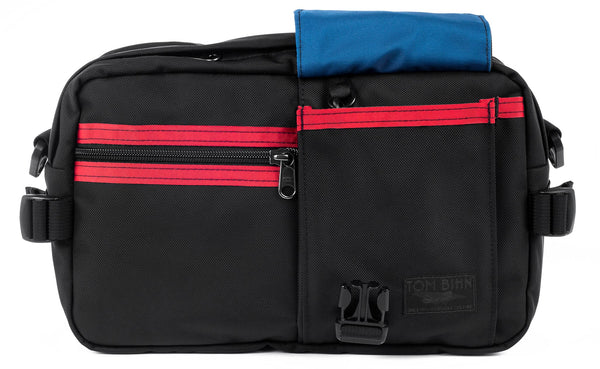 The LGD in Black/Red/Island. Front view, front buckle pocket lifted up to show the Island lining.